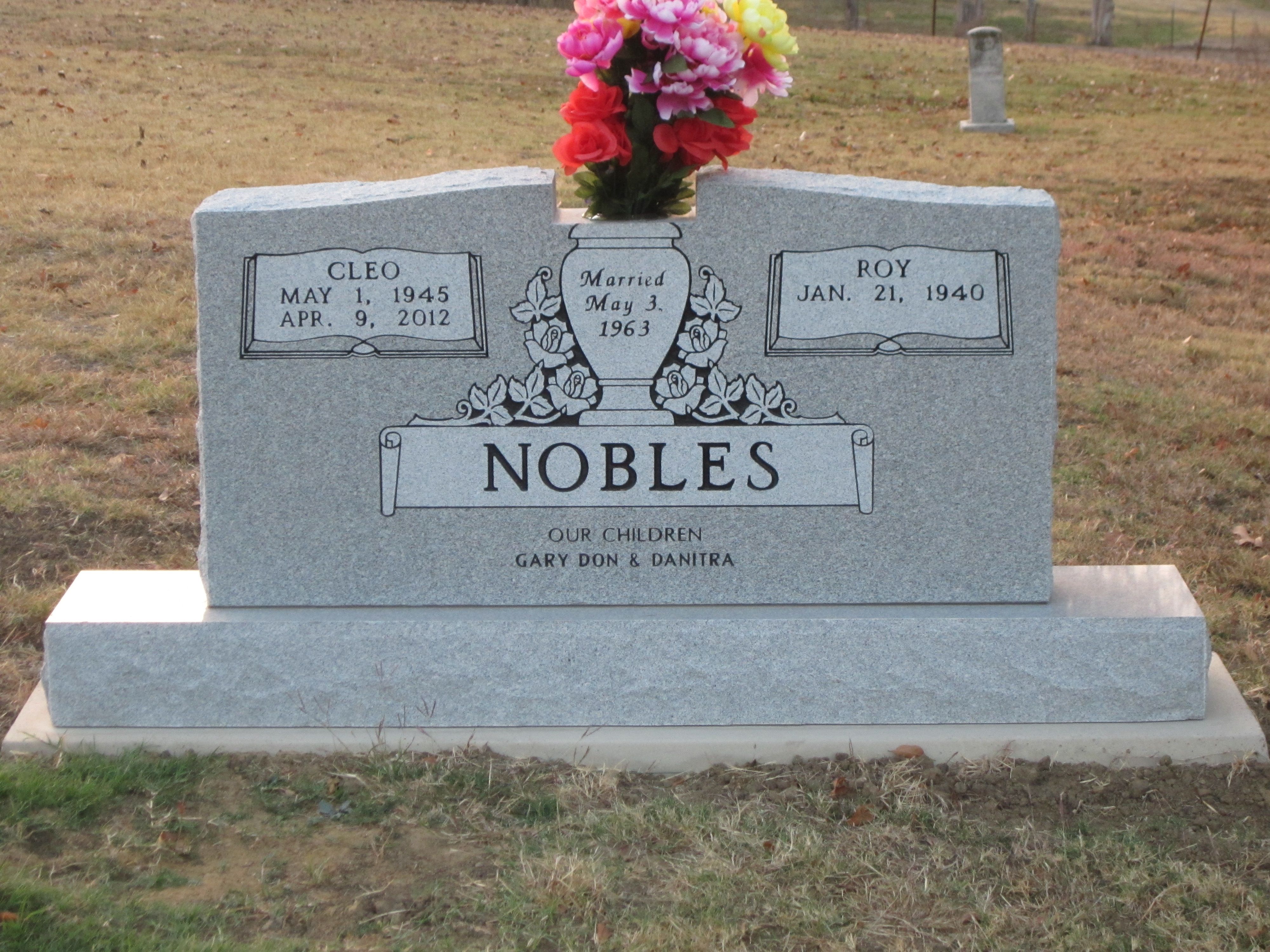 Grey granite headstone with crisp black inscription